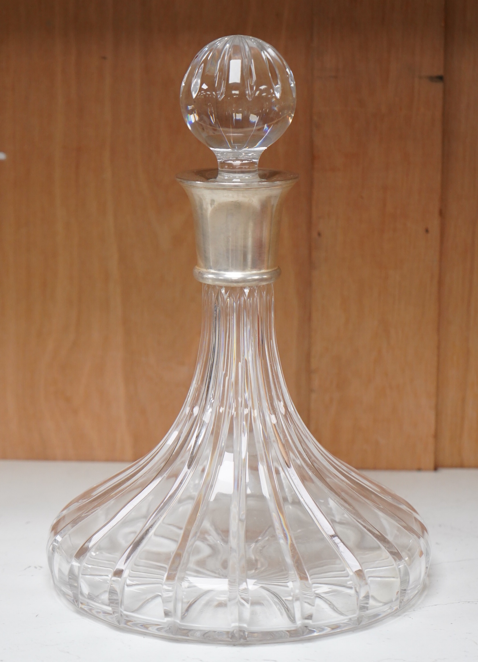 A silver mounted decanter, hallmarked for Sheffield, 2000, 27cm high